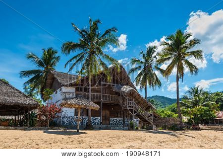Ampasipohy Nosy Be Madagascar - December 19 2015: Colonial house on the beach in the fishing village Ampasipohy on the island of Nosy Be Madagascar.