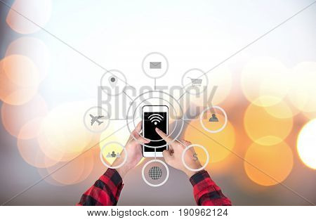 Businessman touching smart phone automation concept with icons showing the functionalities of this new technology