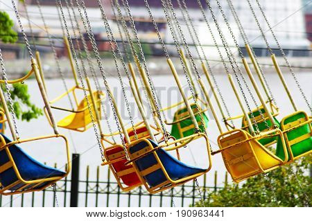 Multicolored carousel in the park, entertainment for children