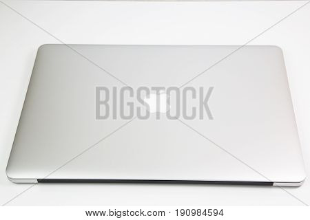 ANKARA,TURKEY - JUNE 11, 2017: New Apple MacBook Pro laptop covered by the plastic film in the box seen from above during the unboxing process