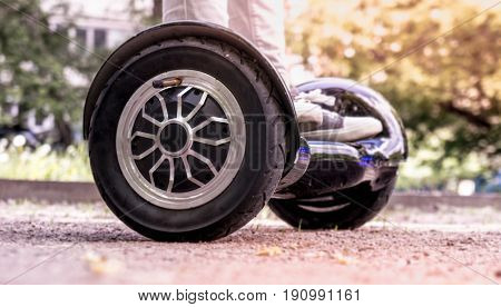 Moscow, Russia, June 7 2017: Girl feet on the hover board.This modern gadget is also known as hoverboard, gyroscooter, mini scooter