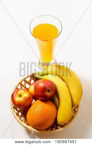citrus juice with fruits on a white wooden table view from top