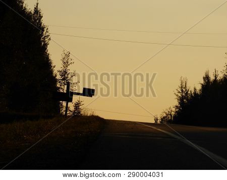 A Backlit Mailbox, Sunsets On Endless Roads