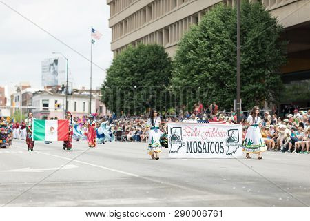 Indianapolis, Indiana, USA - May 26, 2018, Members of the Mexican themed dancing group, Ballet Folklorico Mosaicos, perform at the Indy 500 Parade