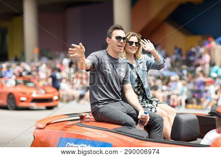 Indianapolis, Indiana, USA - May 26, 2018, Indycar driver Robert Wickens on a car, going down the street  during the Indy 500 Parade