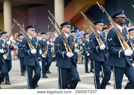 Indianapolis, Indiana, USA - May 26, 2018, Members of the US Air Force march in formation with rifles down the road at the Indy 500 Parade