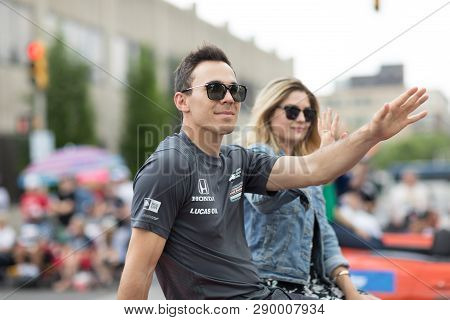 Indianapolis, Indiana, USA - May 26, 2018, Indycar driver Robert Wickens on a car goes down the street at the Indy 500 Parade