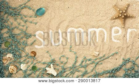Summer White Letters With Seashells And Details On Sandy Background. Summer Flatlay