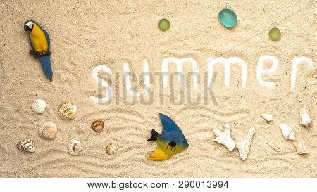 Summer White Letters With Seashells And Details On Sandy Background. Summer Flatlay