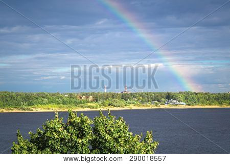 Beautiful Summer Landscape With A Bright Rainbow In The Sky. Blue Sky With White Clouds. Wide Volga 
