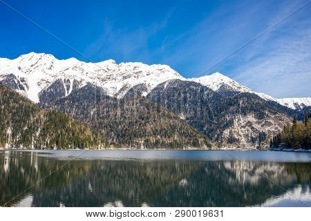 Beautiful View Of The Mountains Covered With Forest And The Lake In The Caucasus In Abkhazia