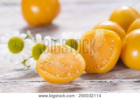 Fruit Of Cape Gooseberry, Uvilla On Wooden Background