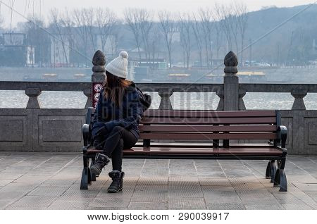 Luoyang, Henan/china- January 19, 2019: The Unspecific Woman Sitting And Looking To The View At The 