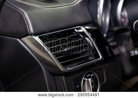 A Close-up View Of A Part Of The Interior Of A Modern Luxury Car With A View Of The Ventilation Defl