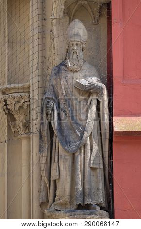 WURZBURG, GERMANY - JULY O4, 2018: Statue of Saint on the portal of the Marienkapelle in Wurzburg, Bavaria, Germany