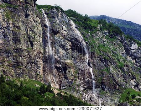 Waterfall Milchbachfall Or Wasserfall Milchbachfäll, Milchbäch Stream In The Alpine Valley Of Madera
