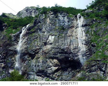 Waterfall Milchbachfall Or Wasserfall Milchbachfäll, Milchbäch Stream In The Alpine Valley Of Madera
