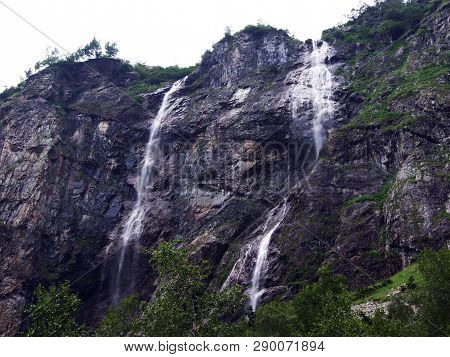 Waterfall Milchbachfall Or Wasserfall Milchbachfäll, Milchbäch Stream In The Alpine Valley Of Madera