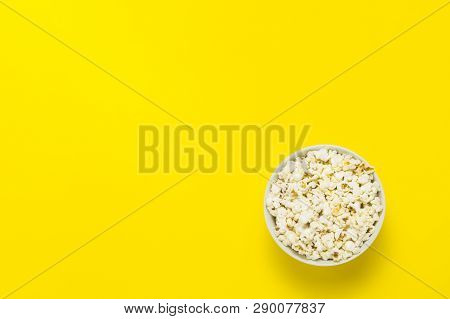 Bowl With Popcorn On A Yellow Background. Flat Lay, Top View.