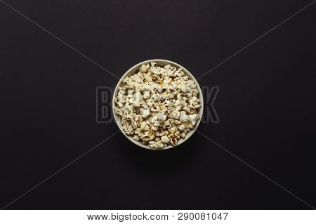 Bowl With Popcorn On A Black Background. Flat Lay, Top View.