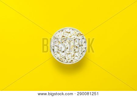 Bowl With Popcorn On A Yellow Background. Flat Lay, Top View.