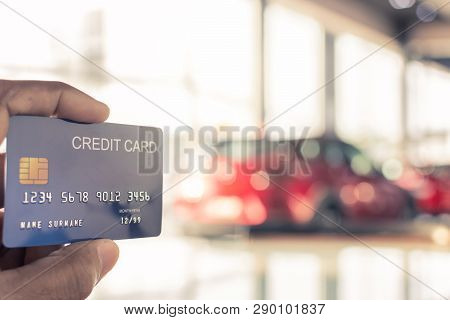 Man Holding Credit Card For Car Blurred Bokeh Background E-shopping Marketing Digital, Consumer Purc