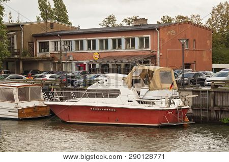 Klaipeda, Lithuania - September 22, 2018: Old Shabby Small Ship Near Embankment In The Center Of Kla
