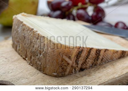 Piece Of French Cheese Tomme De Brebis Made From Sheep Milk Served As Dessert With Fresh Figs And Pe