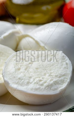 Balls And Pieces Of Buffalo Mozzarella, Soft Italian Scheese Made From The Milk Of Italian Mediterra