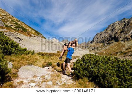 Tourists Trekking In Beautiful Mlynicka Dolina On The Way To Bystre Sedlo - In Slovakian High Tatra 