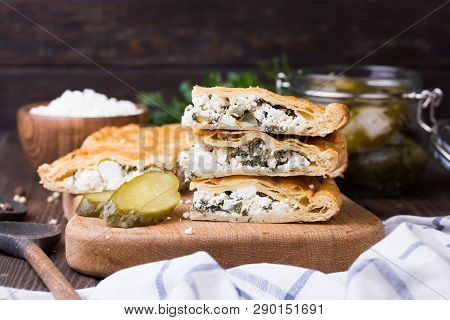 Homemade Puff Pie With Pickled Cucmbers And Cottage Cheese