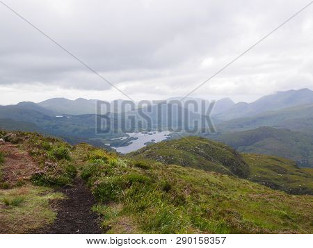 Hike On The Top Of Torc Mountain In Killarney. Hike In Ireland. View On The Mountains, A Lake And On