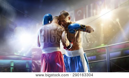 Box Professional Figters On The Ring In Lights