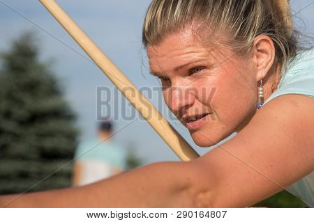 Women Playing Novuss In Outdoors. Novuss Is A National Sport In Latvia Similar To Pocket Billiards O