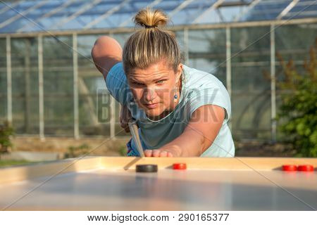 Women Playing Novuss In Outdoors. Novuss Is A National Sport In Latvia Similar To Pocket Billiards O