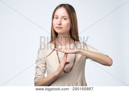 Young Pretty Woman Tired And Bored, Making A Timeout Gesture