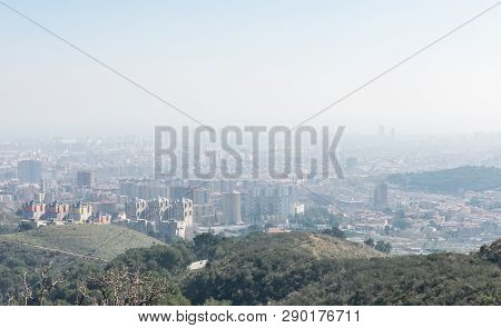 Overview Of The Polluted City Of Barcelona, From The Collserola Mountain, With A Layer Of Smog Over