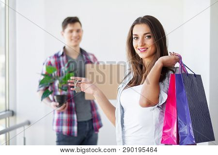 Nnew A Apartment. Happy Couple In Their New Home. Young Couple Hugging Indoors
