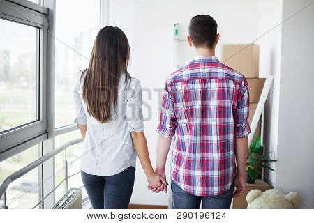 Nnew A Apartment. Happy Couple In Their New Home. Young Couple Hugging Indoors
