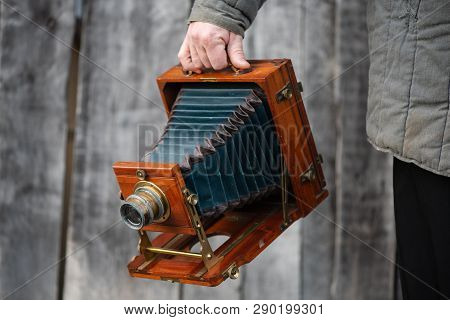 Photographer Holds Old Large Format Studio Camera, 5x7 Inches. Concept - Photography Of The 1930s-19