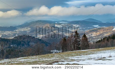 Panorama On Mountain Peaks With Low Hanging Clouds.