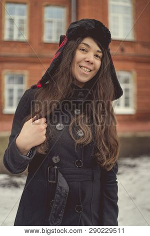 Portrait Of A City Girl In A Blue Jacket. Girl Walking In The Fresh Air