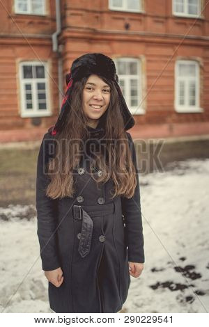 Portrait Of A City Girl In A Blue Jacket. Girl Walking In The Fresh Air