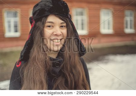 Portrait Of A City Girl In A Blue Jacket. Girl Walking In The Fresh Air