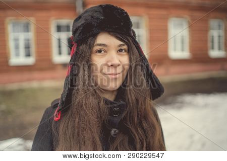 Portrait Of A City Girl In A Blue Jacket. Girl Walking In The Fresh Air