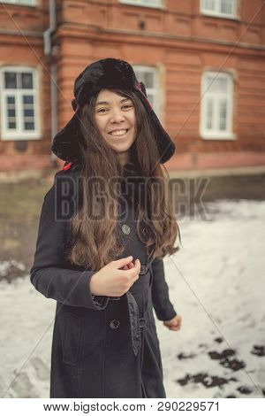 Portrait Of A City Girl In A Blue Jacket. Girl Walking In The Fresh Air