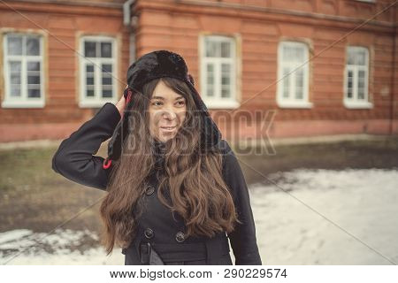 Portrait Of A City Girl In A Blue Jacket. Girl Walking In The Fresh Air