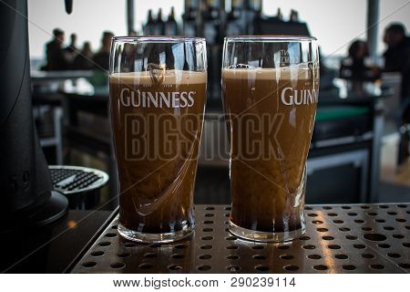 Dublin, Ireland - February 7, 2017- Two Pints Of Guinness On A Stand Almost Ready To Drink Inside Th