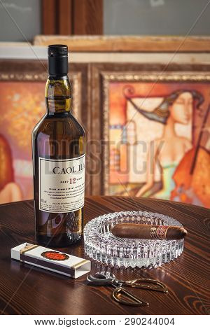 Novosibirsk, Russia - April 07, 2017:  Caol Ila Single Malt Whisky,cigar, Ashtray And Scissors For C