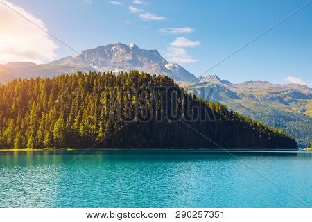 Alpine lake Champfer in beautiful summer day. Location place Silvaplana village, Swiss alps, district Maloja, Europe. Scenic image of most popular vacation destinations. Discover the beauty of earth.